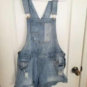 Medium wash Denim Overall shorts.